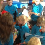 Excited Junior Hub children reading their letters from Hillview Christian School.
